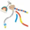 Einschulungs-Anhänger für mit Geschenkbox – Schulkind Schlüsselanhänger mit Holzherz, Regenbogen, ABC-Perlen und SCHULKIND Schriftzug